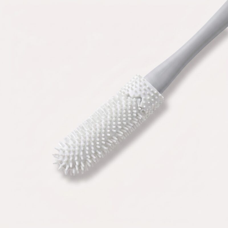 fodskrubber i pink og grå til skånsom rengøring og eksfoliering af fødder og tåmellemrum - Rejse product image